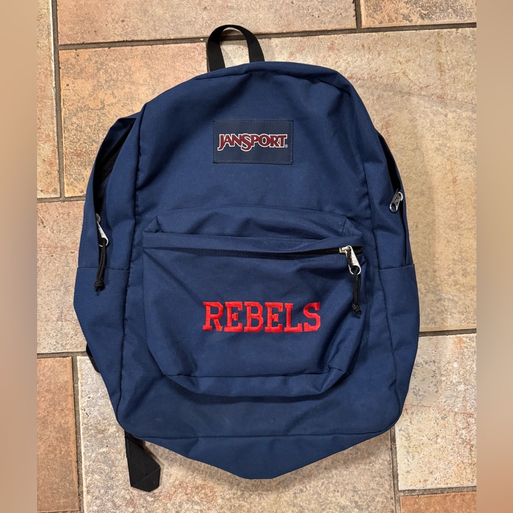 Jansport Navy Blue with Embroidered Red “Rebels” Backpack